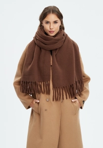Close-up of deep brown thick cashmere-feel scarf with long fringe on a camel coat