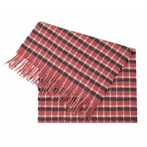 Macro shot of red and black classic plaid knit scarf featuring long fringe tassels