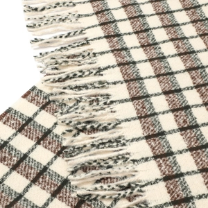 Close-up of beige and brown checkered scarf texture with elegant tassel fringe detail
