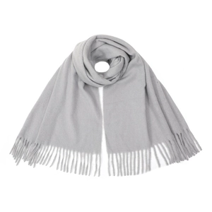 Close-up of soft light grey knit scarf showing fine texture and fringe tassel details