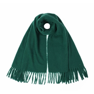 Detail of dark green knit scarf featuring elegant fringe tassels on a white background