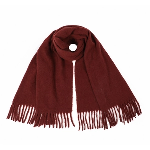 Detailed close-up of dark wine red cashmere-like scarf featuring thick fringe tassels