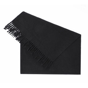 Detail of solid black cashmere-feel scarf showing soft texture and long fringe edges