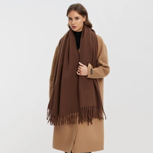 Solid dark brown cashmere-style scarf with tassels for winter, shown on camel coat