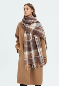 Classic khaki plaid scarf with fringe paired with a premium camel wool winter coat