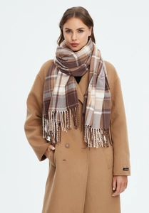 Detail view of khaki plaid scarf with fringe and handmade wool coat sleeve