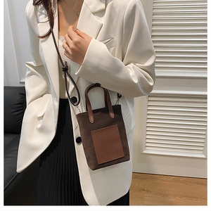 Brown suede and leather mini crossbody bag shown with a stylish autumn outfit