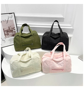 Detailed view of lightweight nylon tote bags in olive, black, beige, and pink colors