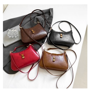 Top view of retro leather underarm bags in four colors with gold metal clasps