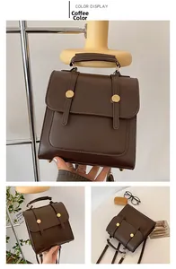 Detail view of coffee brown vintage backpack showing flap closure and metal buckles