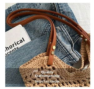 Detail of khaki woven tote bag with brown leather straps and vintage metal rivets