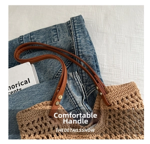 Detail of camel hand-woven bucket bag with brown leather handles and gold metal rivets