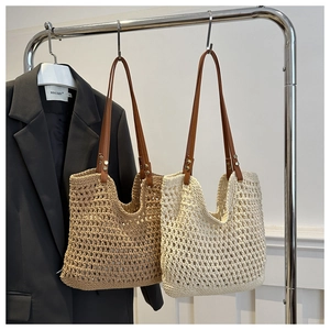 Hollow out woven straw tote bag with leather straps for summer beach vacations