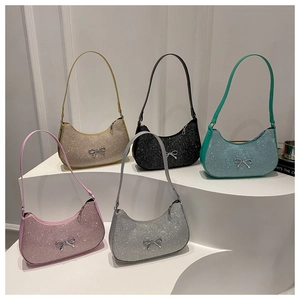 Detailed close-up showing five shimmering sequin hobo bags with metallic bow accents