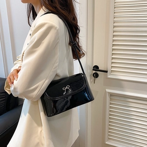 Chic black patent leather shoulder bag with silver rhinestone bow knot for women