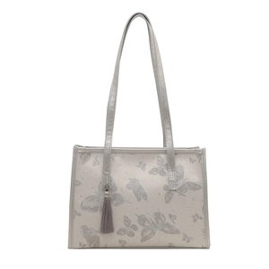 Elegant off-white tote bag with silver butterfly embroidery and grey tassel accessory