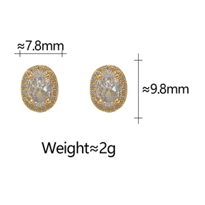 Detail shot showing 7.8mm x 9.8mm oval zircon stud earrings with size measurements