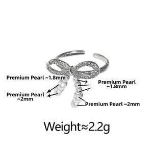 Detailed view of bow ring with small pearls and zircons showing dimensions and weight