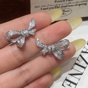 Sparkling silver bow earrings with micro-pave cubic zirconia crystals for women