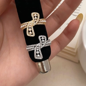 Elegant knotted metal open ring with zircon crystals and small white pearls