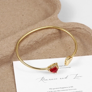 Minimalist 18K gold-plated brass cuff with heart red gemstone and gold heart charm