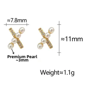 Detail showing dimensions of gold X-shaped earring with pearls and zircon stones