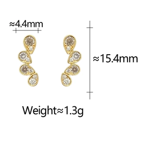 Macro shot of gold teardrop earrings with dimensions 4.4mm by 15.4mm and 1.3g weight