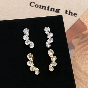 Elegant teardrop pavé stud earrings in gold and silver finish with sparkling zircons