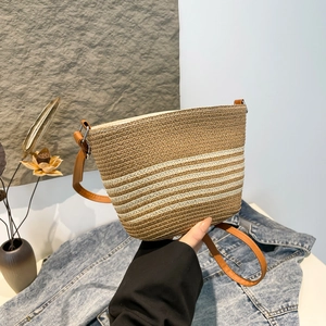 French style woven straw crossbody bag with striped pattern and brown leather strap