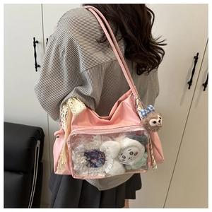 Pink ita bag tote featuring a transparent PVC display window with plush toys and pins