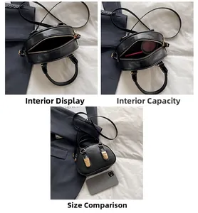 Vista interna della borsa a conchiglia nera con spazio per telefono e trucco con dettagli oro