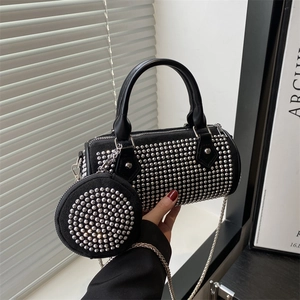 Black studded cylinder Boston bag with chain strap and matching coin purse