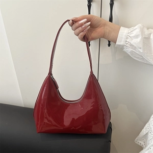 Glossy red patent leather crescent hobo bag with GAIA CULT logo and silver zipper
