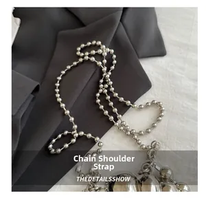 Detail of a bright silver beaded metal chain strap for stylish shoulder and crossbody bags