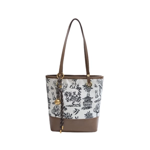 Chinese style floral canvas and brown leather bucket bag with a golden bell charm