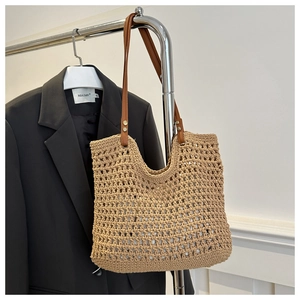 Large capacity woven straw tote bag with brown handles and hollow design for beach summer