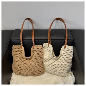 Detail of woven tote bags with leather handles and hollow crochet craftsmanship