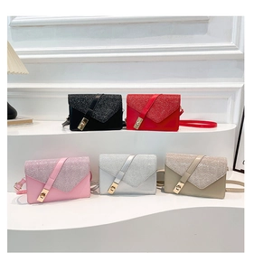Detail of glitter flap small square bags with gold twist locks in five trendy colors