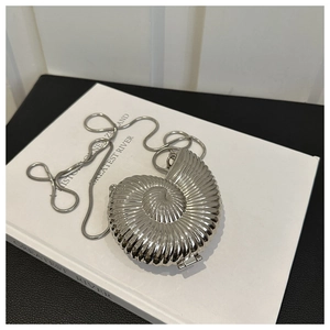 Silver nautilus shell evening clutch with metallic spiral texture and snake chain strap