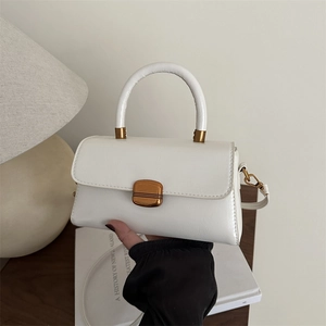 Minimalist white faux leather handbag with gold buckle and top handle for women