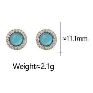Detail view of round 11.1mm blue gemstone stud earrings with small zircon halo decoration