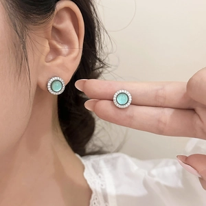Elegant silver earrings with pale green cat eye stone and sparkling zircon halo