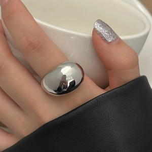 Minimalist polished silver oversized pebble ring with mirror finish for a bold look