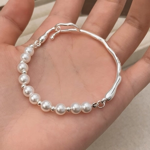 Silver textured wave metal and white pearl asymmetrical bracelet for women