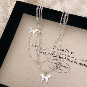 Elegant clear crystal beaded layered necklace with delicate white butterfly pendants