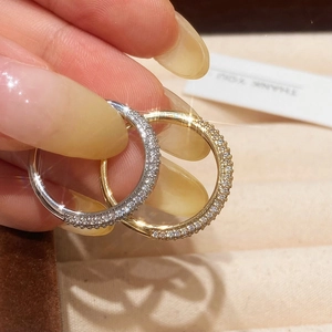 Minimalist gold and silver rings with full pave cubic zirconia in a starry micro-set design