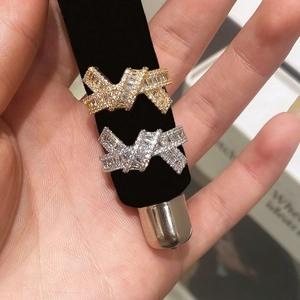 Sparkling bow knot rings with zircon stones in gold and silver finishes for women