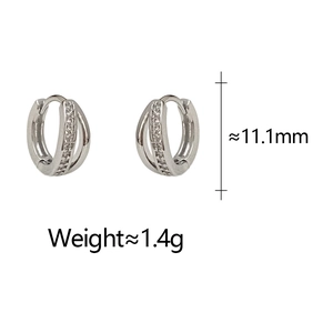Macro shot of double-layered silver hoop earrings with zircon detail, size 11.1mm