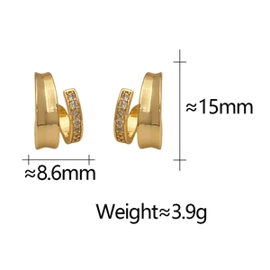Detail shot of double-layered gold hoop earrings with dimensions 8.6mm by 15mm
