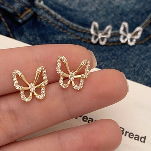 Elegant hollow butterfly stud earrings in gold with sparkling white cubic zirconia stones